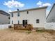 Back of house, two-story, light beige vinyl siding, deck at 1414 Kings Grove Dr, York, SC 29745