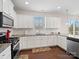 Spacious kitchen with granite countertops and white cabinets at 1414 Kings Grove Dr, York, SC 29745