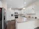 Modern kitchen featuring white cabinets, granite countertops, and stainless steel appliances at 1414 Kings Grove Dr, York, SC 29745