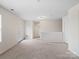 Spacious loft area with carpet, a door, and neutral walls at 1414 Kings Grove Dr, York, SC 29745