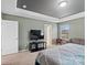 Main bedroom with TV, large bed, and access to bathroom at 1414 Kings Grove Dr, York, SC 29745