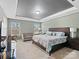 King-size bed, two windows, and a neutral color palette at 1414 Kings Grove Dr, York, SC 29745