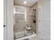 Walk-in shower with neutral tile and glass enclosure at 1414 Kings Grove Dr, York, SC 29745