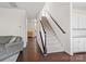 Elegant staircase with dark wood railing and carpeted steps at 1414 Kings Grove Dr, York, SC 29745