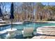 Inviting backyard pool with patio and lake views at 160 Palmer Marsh Pl, Mooresville, NC 28117