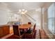 Spacious dining room with hardwood floors, chandelier, and view of living room at 2010 Olde Oxford Ct, Rock Hill, SC 29732