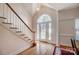 Bright entryway with staircase and stained glass door at 2010 Olde Oxford Ct, Rock Hill, SC 29732