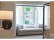 Light-filled bedroom with window seat and neutral decor at 2026 Thatcher Way, Fort Mill, SC 29715