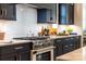 Stylish kitchen with dark cabinetry, white subway tile, and gas range at 2026 Thatcher Way, Fort Mill, SC 29715