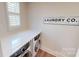 Laundry room with white quartz countertops and modern appliances at 2026 Thatcher Way, Fort Mill, SC 29715