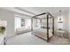 Spacious main bedroom with a four-poster bed and a window seat at 2026 Thatcher Way, Fort Mill, SC 29715