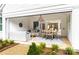 Covered outdoor patio with seating and dining areas, extending living space at 2026 Thatcher Way, Fort Mill, SC 29715