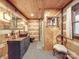 Bathroom features log cabin walls, a walk-in shower, and a stylish vanity at 2577 Dutch Rd, Mount Pleasant, NC 28124
