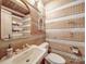 Rustic bathroom with log cabin walls and a pedestal sink at 2577 Dutch Rd, Mount Pleasant, NC 28124