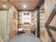 Bathroom with walk-in shower, rustic wood walls, and a unique vanity at 2577 Dutch Rd, Mount Pleasant, NC 28124
