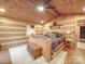 Charming bedroom with log cabin walls, a large bed, and a rustic feel at 2577 Dutch Rd, Mount Pleasant, NC 28124