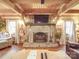Rustic stone fireplace in a cozy log cabin living room at 2577 Dutch Rd, Mount Pleasant, NC 28124