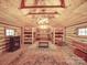 Cabin interior with bunk beds, wood walls, and a fireplace at 2577 Dutch Rd, Mount Pleasant, NC 28124