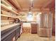 Rustic kitchen with stainless steel appliances and wood cabinets at 2577 Dutch Rd, Mount Pleasant, NC 28124