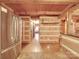 Open concept kitchen with log cabin features and granite countertop at 2577 Dutch Rd, Mount Pleasant, NC 28124
