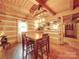 Charming kitchen features log cabin details and a breakfast bar at 2577 Dutch Rd, Mount Pleasant, NC 28124