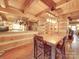 Log cabin kitchen with breakfast bar and stainless steel appliances at 2577 Dutch Rd, Mount Pleasant, NC 28124