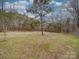 Wooded land with grassy areas and a few trees at 2577 Dutch Rd, Mount Pleasant, NC 28124