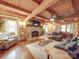 Cozy living room with stone fireplace and leather sofas at 2577 Dutch Rd, Mount Pleasant, NC 28124