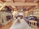 Spacious living room with stone fireplace and log cabin aesthetic at 2577 Dutch Rd, Mount Pleasant, NC 28124