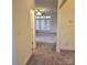 Hallway with carpeted floor leading to living room at 4612 Waterbell Ln, Waxhaw, NC 28173