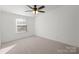 Bright bedroom with carpeted floor and a large window at 48252 Hwy 731 Hwy, Norwood, NC 28128