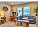 Spacious living room with a blue sofa and wooden coffee table at 508 Cranford Dr, Pineville, NC 28134