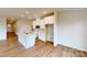 Modern kitchen with white cabinets, quartz countertops, and an island at 600 Banter Ln # 27, Cramerton, NC 28032