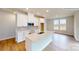 Modern kitchen featuring white cabinets, quartz countertops, and stainless steel appliances at 600 Banter Ln # 27, Cramerton, NC 28032