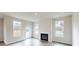 Bright living room with fireplace, wood floors, and access to backyard at 600 Banter Ln # 27, Cramerton, NC 28032