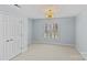 Spacious bedroom with double doors and large window at 6604 Morrowick Circle Dr, Charlotte, NC 28226