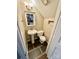 Small half bathroom with pedestal sink and toilet at 701 Victorian Ln, Monroe, NC 28112