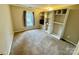 Bedroom with built-in shelving and window views at 701 Victorian Ln, Monroe, NC 28112