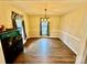 Formal dining room with hardwood floors and a chandelier at 701 Victorian Ln, Monroe, NC 28112