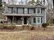 Two-story house featuring a wraparound porch and a spacious yard at 701 Victorian Ln, Monroe, NC 28112
