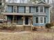 Two-story house featuring a wraparound porch and a spacious yard at 701 Victorian Ln, Monroe, NC 28112
