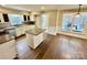 Spacious kitchen with an island, stainless steel appliances, and light cabinets at 701 Victorian Ln, Monroe, NC 28112