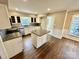 Spacious kitchen with an island, stainless steel appliances, and light cabinets at 701 Victorian Ln, Monroe, NC 28112