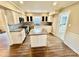 Spacious kitchen with an island, stainless steel appliances, and light cabinets at 701 Victorian Ln, Monroe, NC 28112