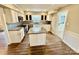 Spacious kitchen with an island, stainless steel appliances, and light cabinets at 701 Victorian Ln, Monroe, NC 28112