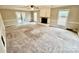 Spacious living room featuring a fireplace and patio doors at 701 Victorian Ln, Monroe, NC 28112