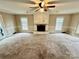 Living room with fireplace, lots of natural light, and access to a deck at 701 Victorian Ln, Monroe, NC 28112