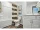 Clean bathroom with a shower/tub combo, neutral shower curtain, and modern vanity at 7232 Hodges Meadow Ln, Charlotte, NC 28213