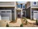 Charming townhome showcasing a covered entryway, a garage and manicured landscaping adding to the curb appeal at 7232 Hodges Meadow Ln, Charlotte, NC 28213
