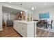 Bright kitchen with white cabinetry, a spacious island, and an open layout perfect for entertaining at 7232 Hodges Meadow Ln, Charlotte, NC 28213
